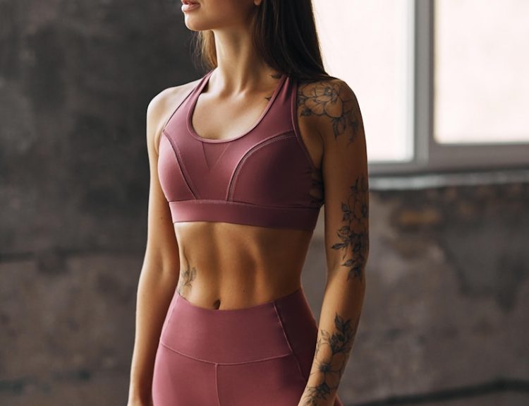 woman in pink sports bra and pink leggings