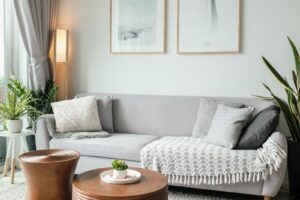 a living room filled with furniture and a large window