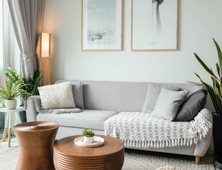 a living room filled with furniture and a large window