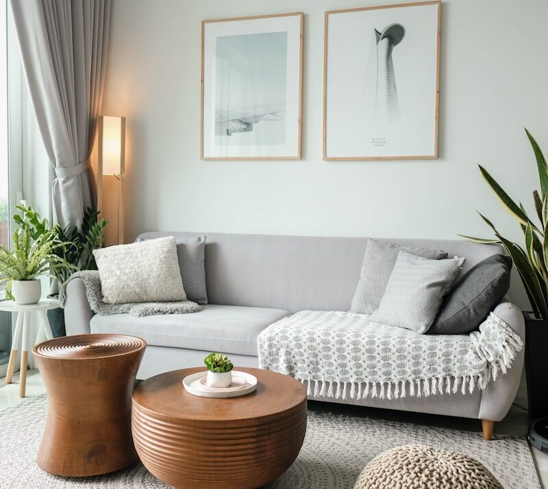 a living room filled with furniture and a large window