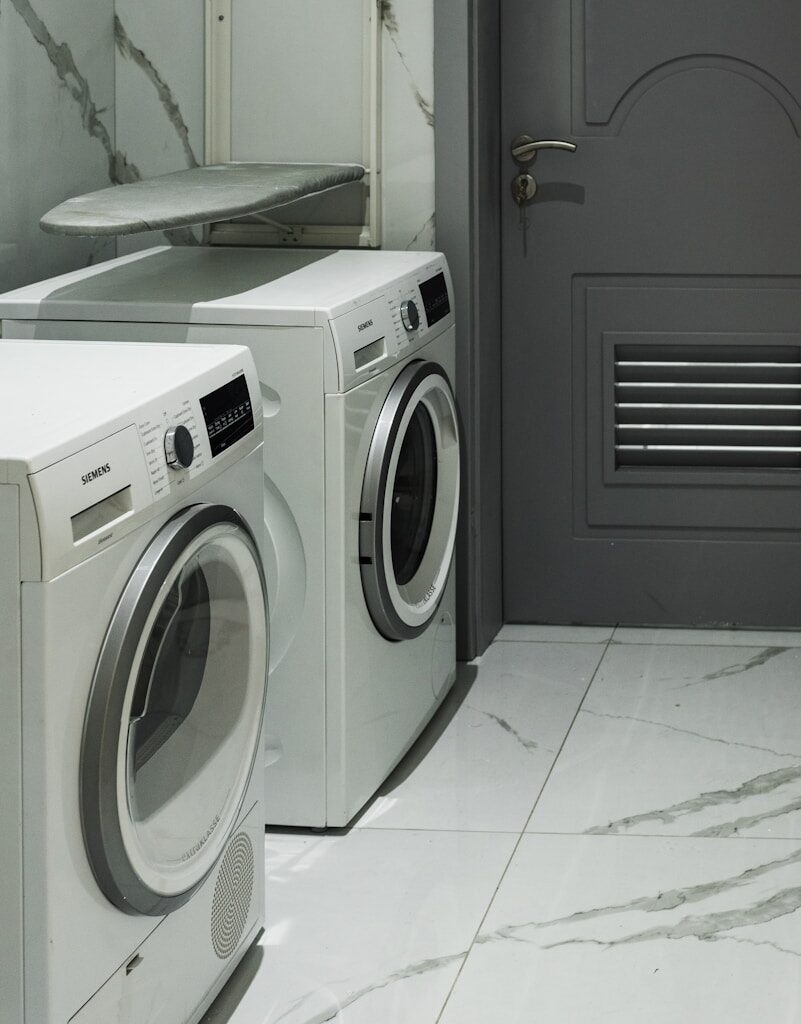 a washer and dryer sitting next to each other