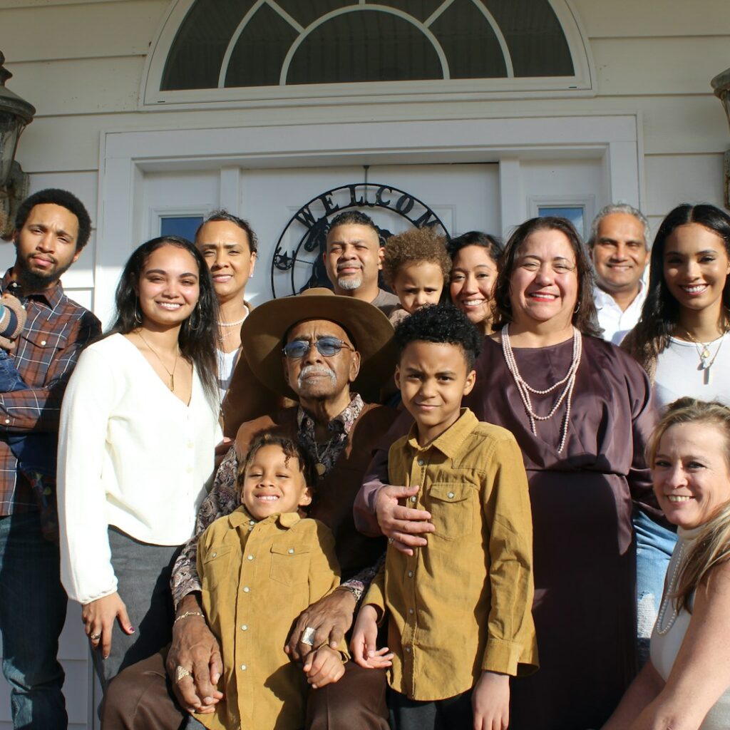 group of people standing near white building